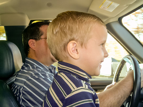 Bradlyn Zimmerman driving with his dad to a furniture delivery