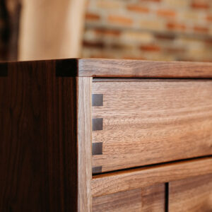 Custom Black Walnut Contemporary Solid Wood Credenza with three drawers and paneled doors - Up Close