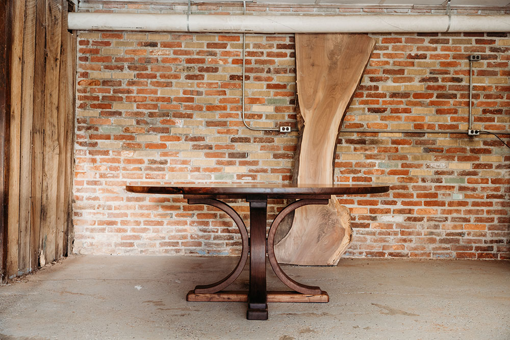 Custom Black Walnut Round Dining Table with Pedestal Arch Base and bookmatched solid wood top - 027 - side view
